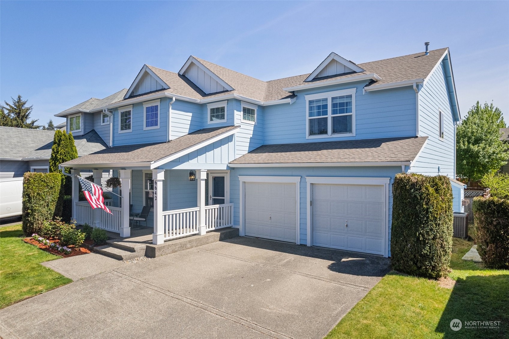 6642 Compass Street Southeast Lacey, WA 98513 - Photo 38 of 40 a view of a house with a yard and garage