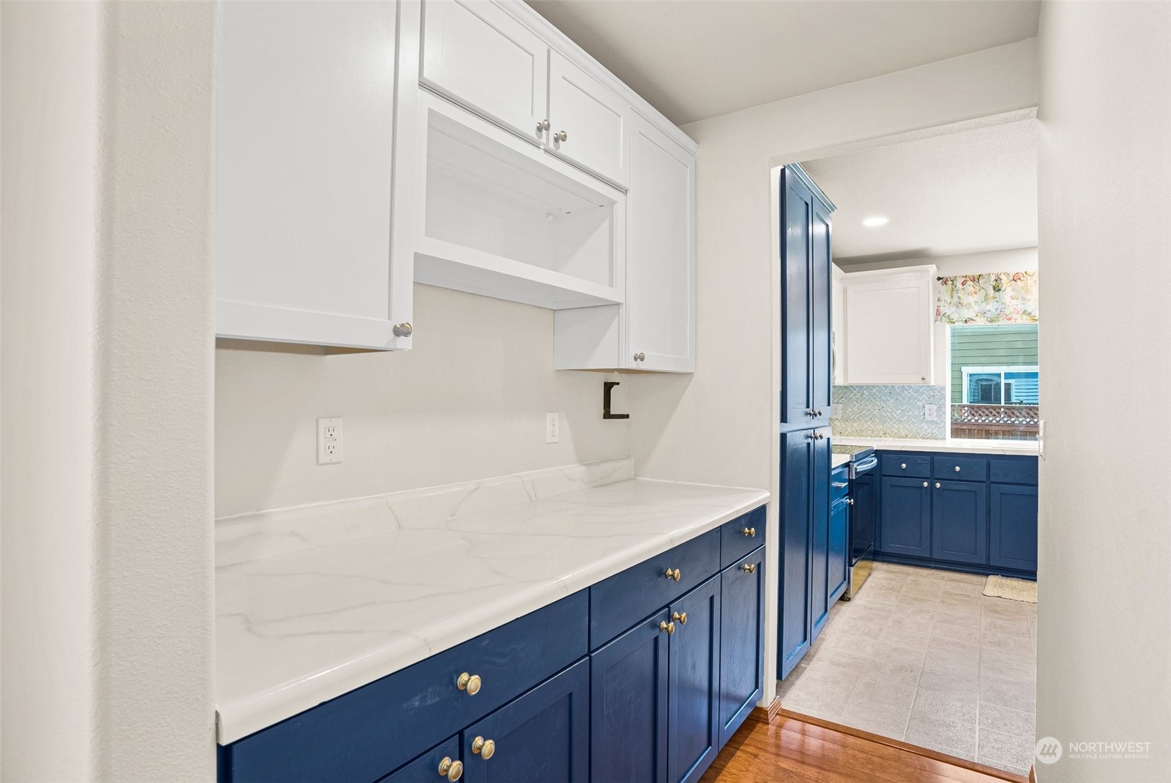 6642 Compass Street Southeast Lacey, WA 98513 - Photo 10 of 40 a kitchen with stainless steel appliances granite countertop a sink and dishwasher with wooden cabinets