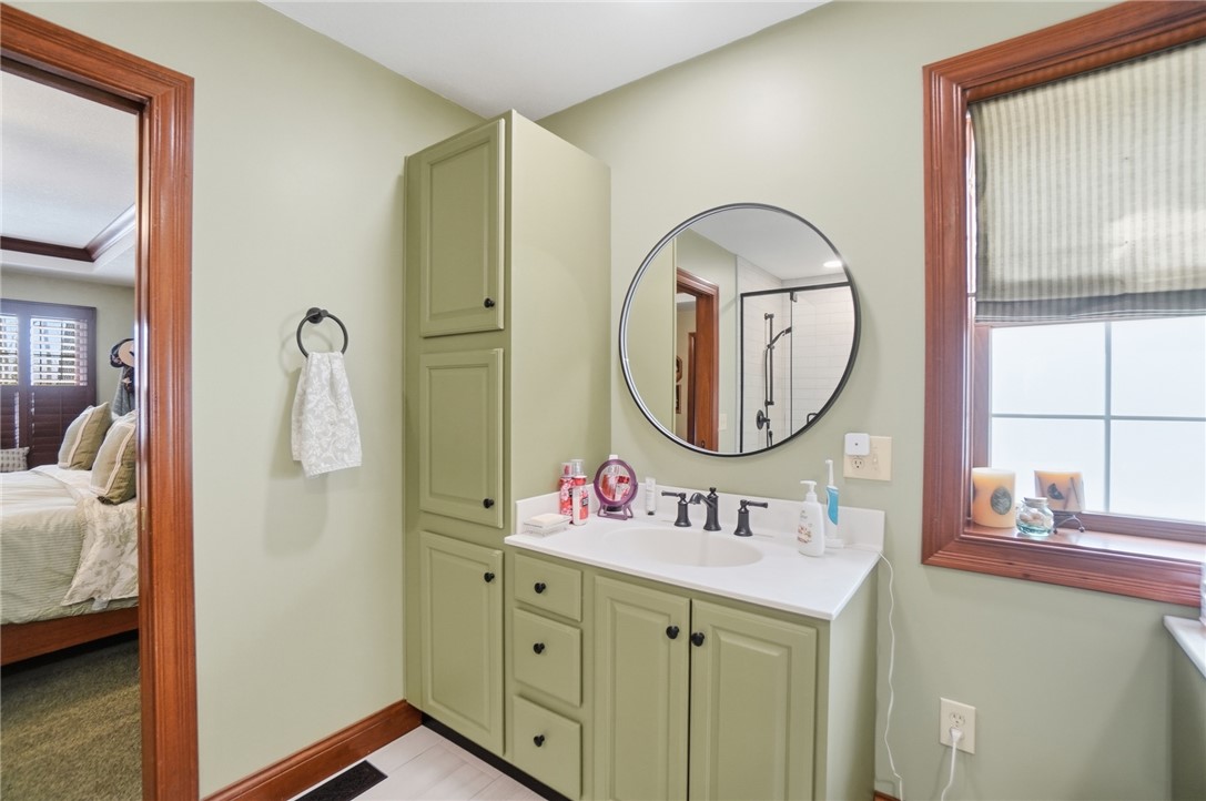 5300 Brookshire Lane Springfield, OH 45502 - Photo 30 of 56 This primary bathroom features a vanity, ample storage, and a well-lit space.
