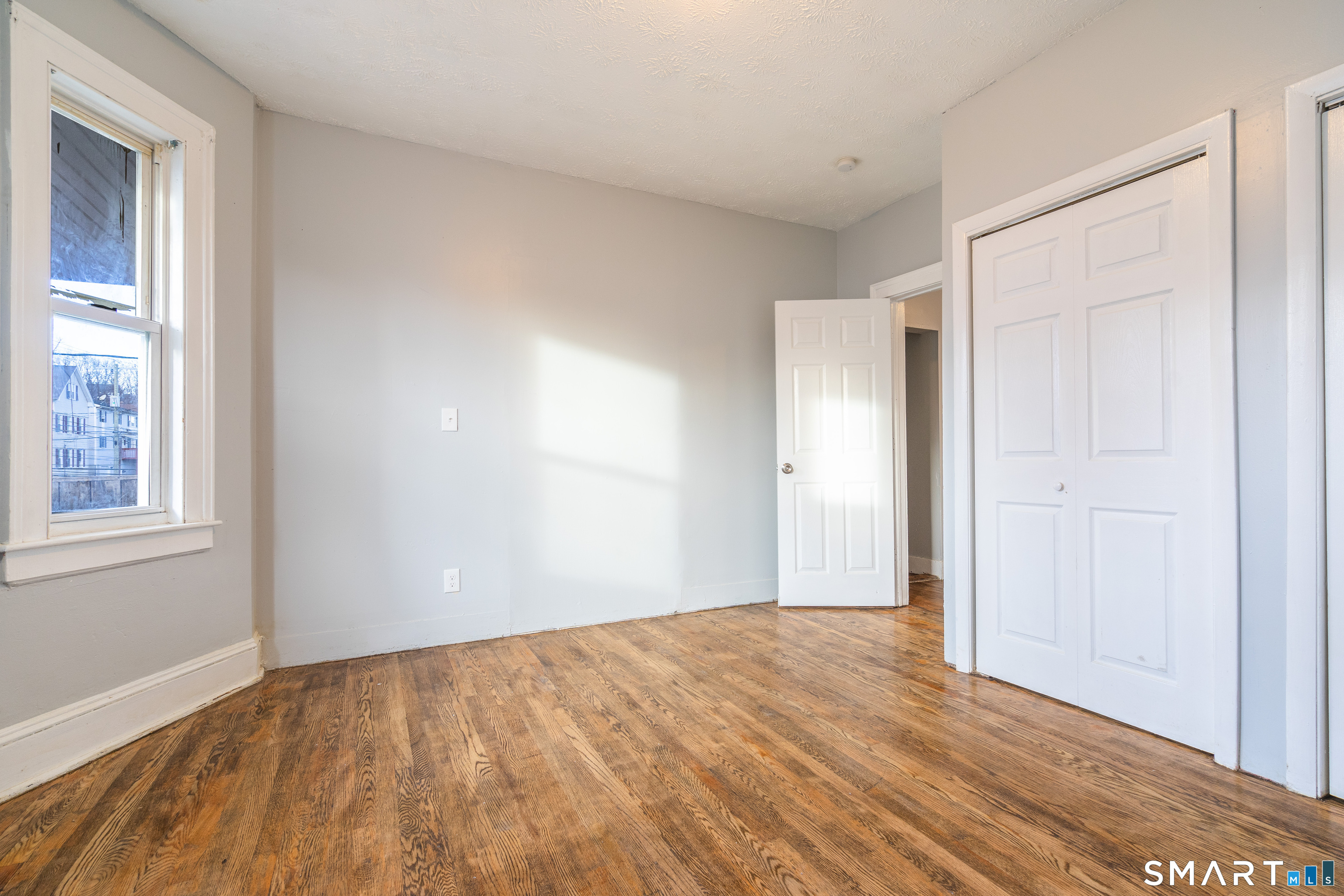 109 Clark Street New Britain, CT 06051 - Photo 7 of 24 a view of an empty room and window