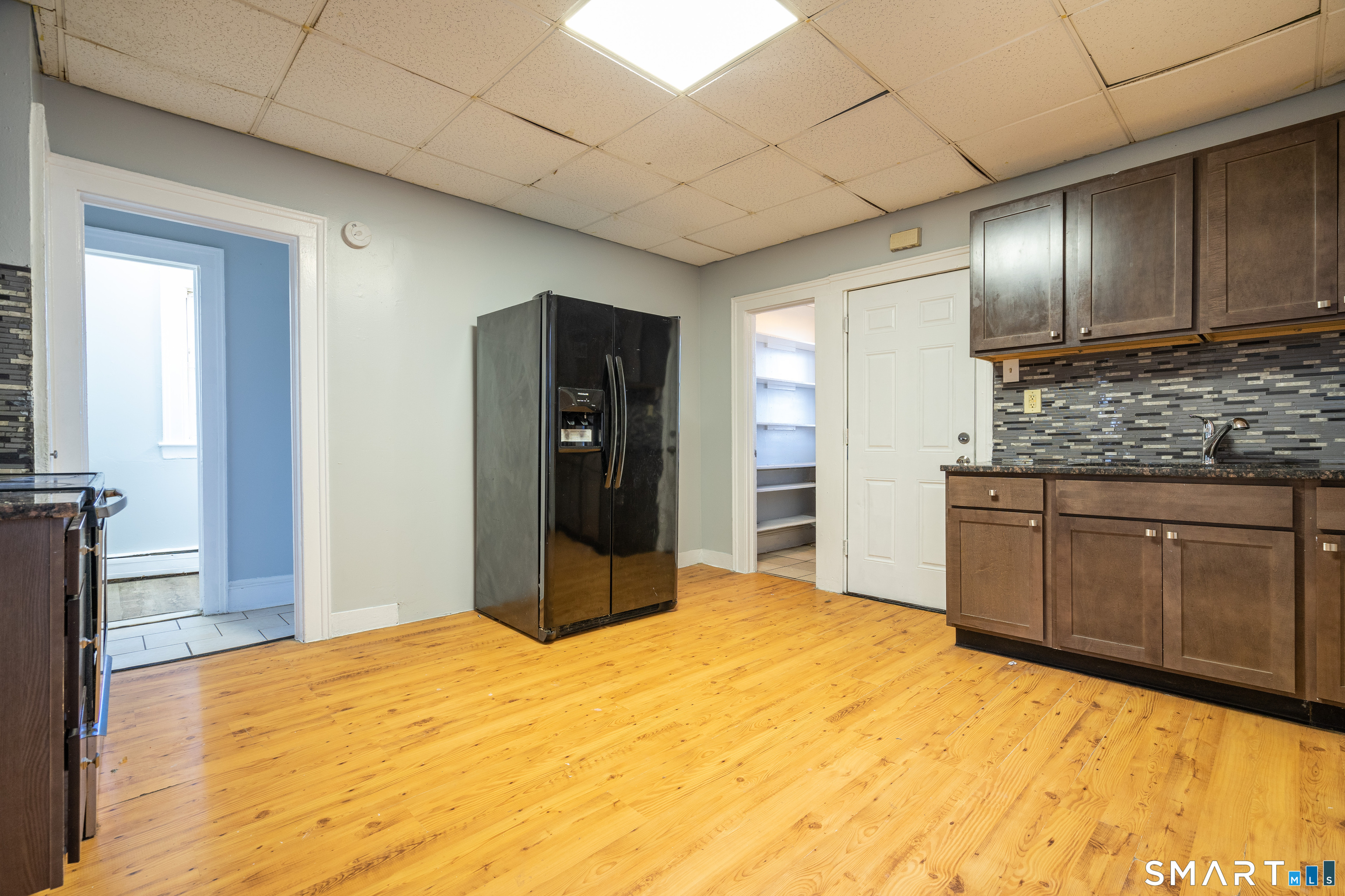 109 Clark Street New Britain, CT 06051 - Photo 9 of 24 a bedroom with a bed and cabinets