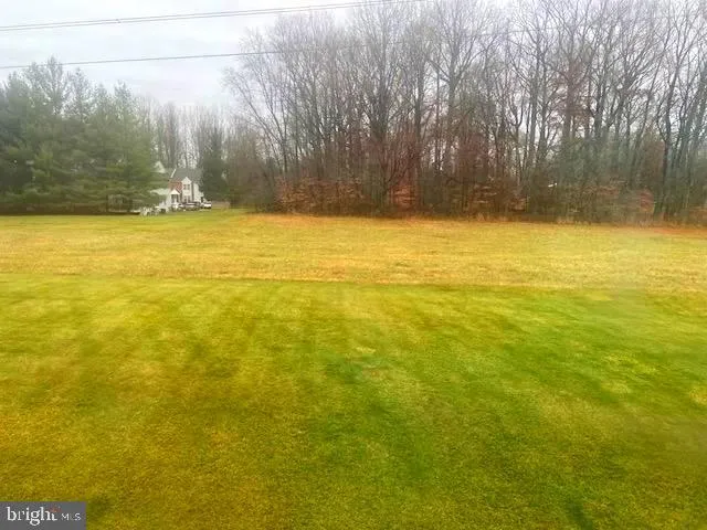 a view of swimming pool with an outdoor space and seating area