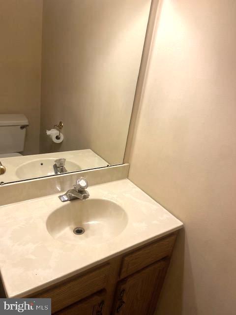86 Louis James Court, Unit 86 Upper Chichester, PA 19014 - Photo 5 of 12 a bathroom with a sink and a mirror