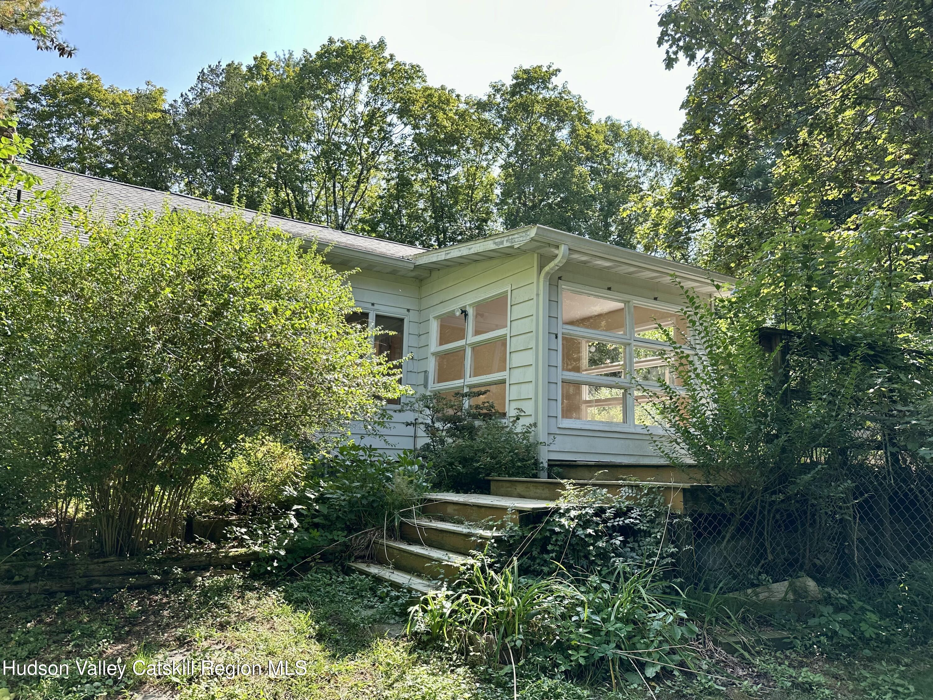 197 Old Rte 32 Saugerties, NY 12477 - Photo 3 of 31 a yellow house with trees in front of it