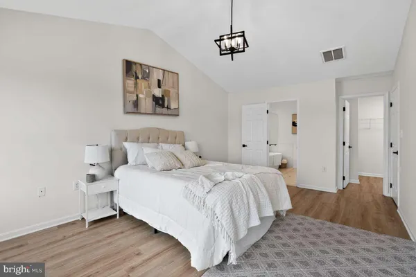 a bedroom with a bed and a couch