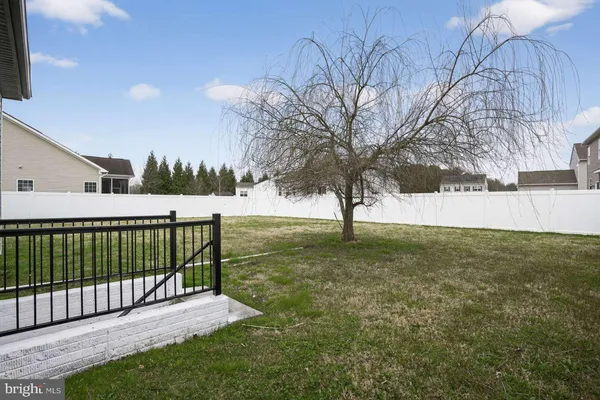 a view of backyard with green space