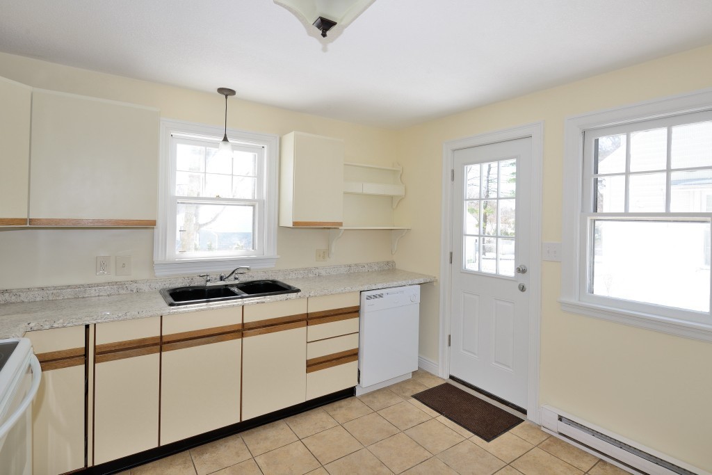 155 Carroll Street Springfield, MA 01108 - Photo 3 of 15 a kitchen that has a sink a window and cabinets