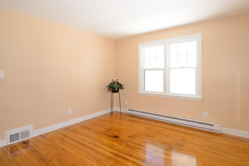 155 Carroll Street Springfield, MA 01108 - Photo 5 of 15 a view of a room with wooden floor and small window