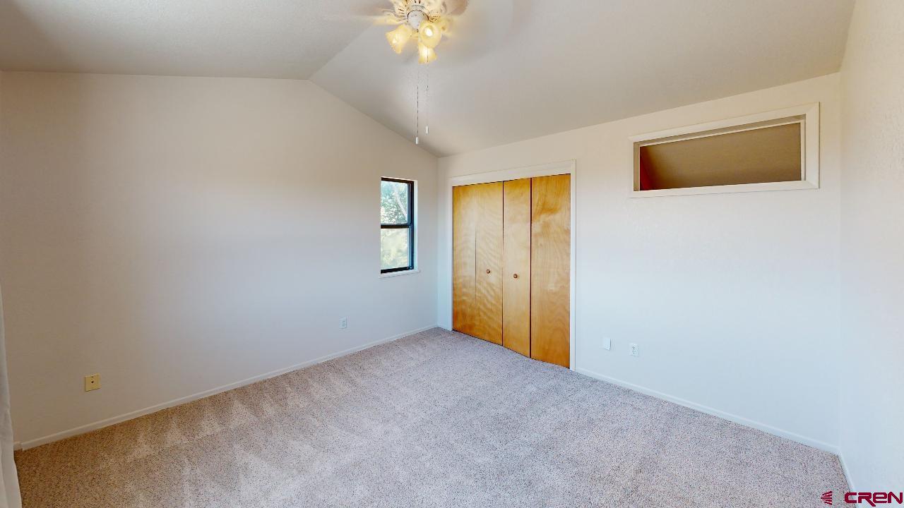 16407 Happy Hollow Road Cedaredge, CO 81413 - Photo 15 of 35 a view of an empty room with window