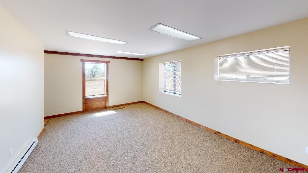 16407 Happy Hollow Road Cedaredge, CO 81413 - Photo 24 of 35 a view of an empty room with a window