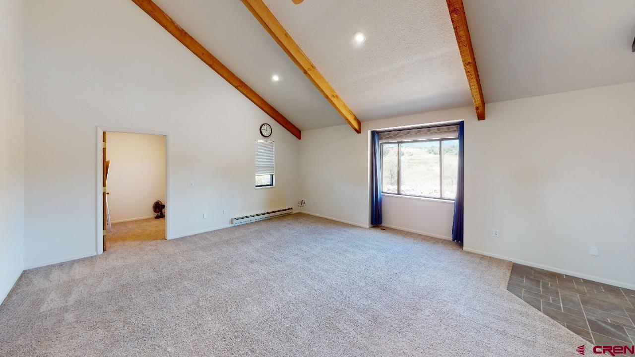 16407 Happy Hollow Road Cedaredge, CO 81413 - Photo 6 of 35 an empty room with windows