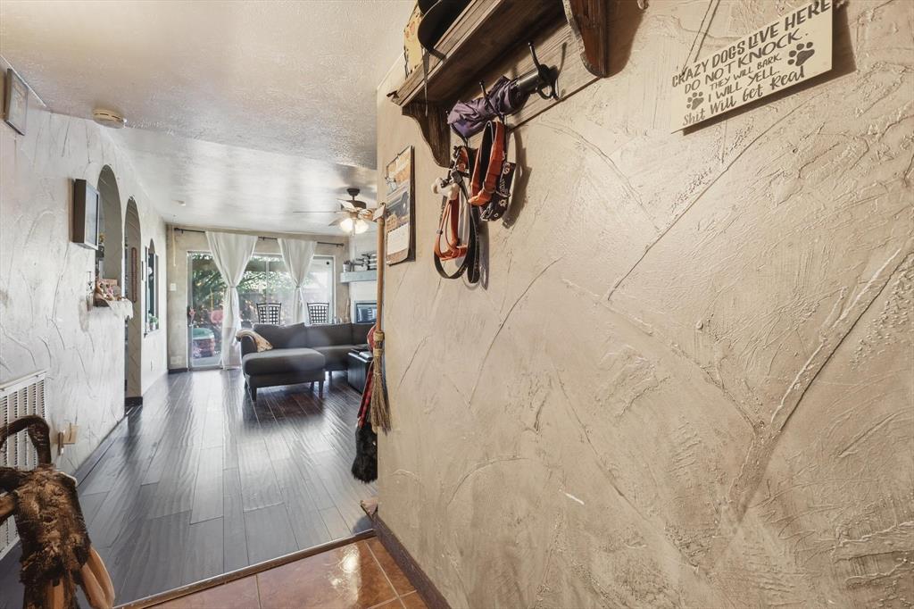 6317 Locust Street Rowlett, TX 75089 - Photo 6 of 34 Hall featuring a textured wall and arched walkways
