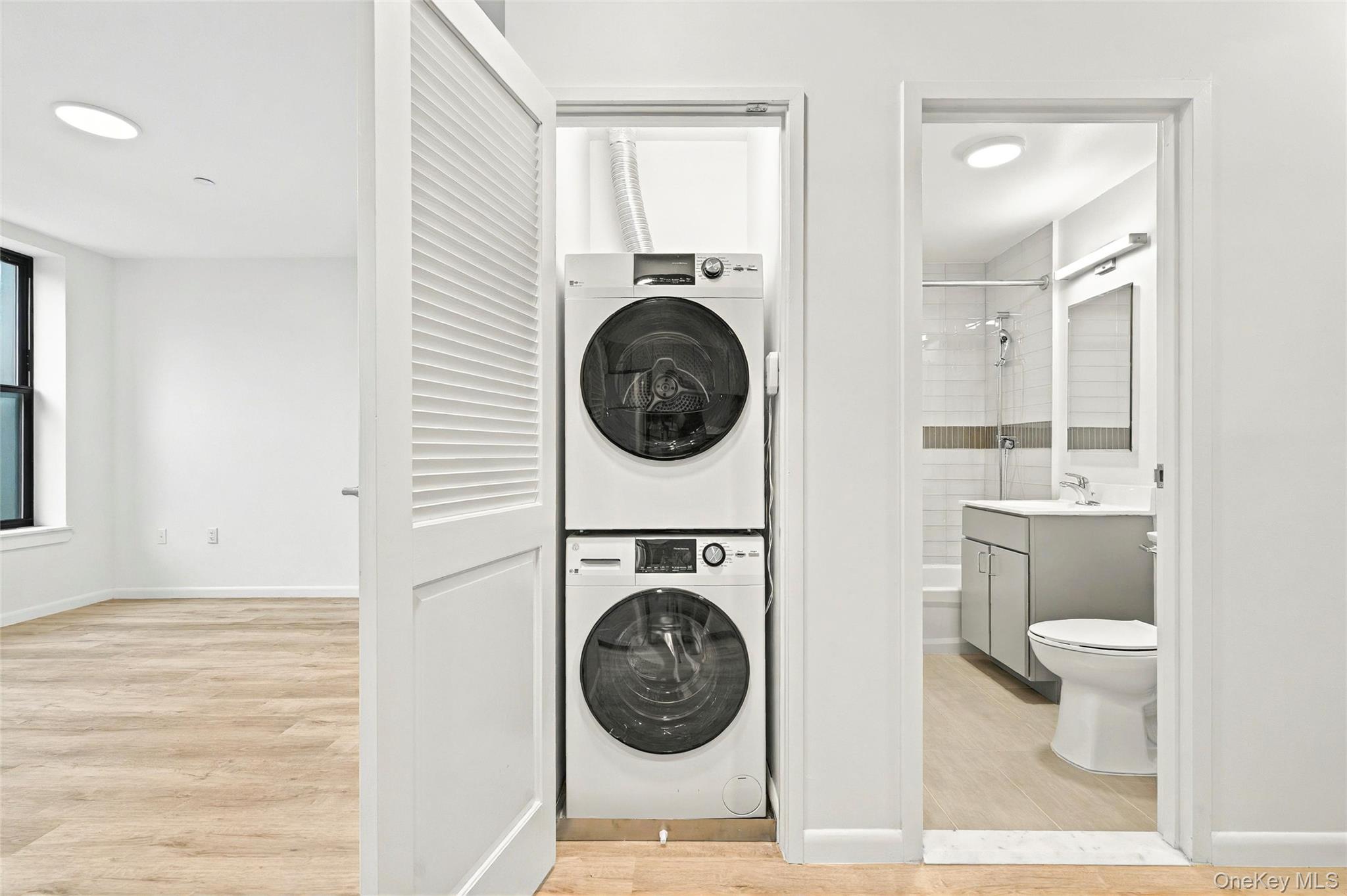 1739 Lacombe Avenue, Unit 1B Bronx, NY 10473 - Photo 18 of 23 a view of a bathroom with washing machine and a sink