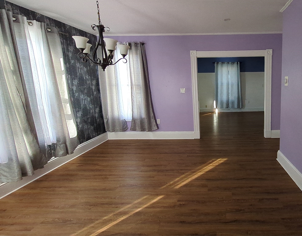 7 Cherry Street Lynn, MA 01902 - Photo 14 of 42 a view of a room has wooden floor and stairs