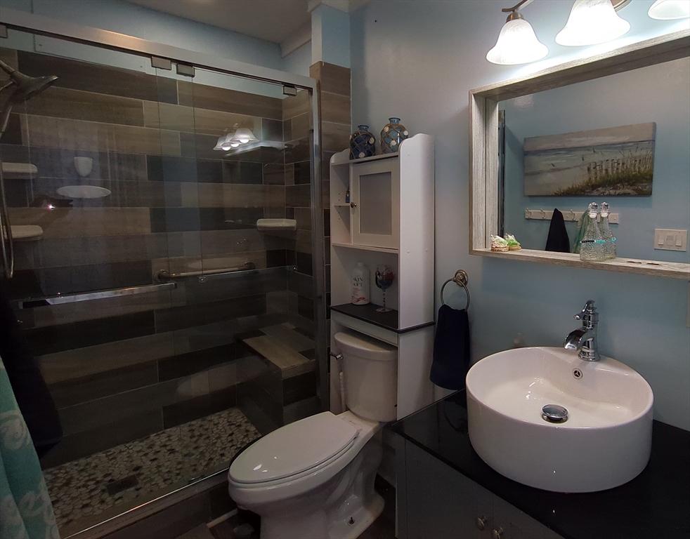 7 Cherry Street Lynn, MA 01902 - Photo 15 of 42 a bathroom with a sink toilet and shower