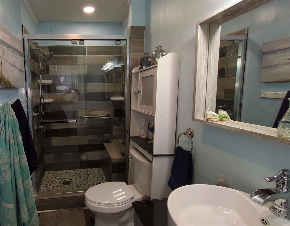 7 Cherry Street Lynn, MA 01902 - Photo 16 of 42 a bathroom with a toilet and a shower