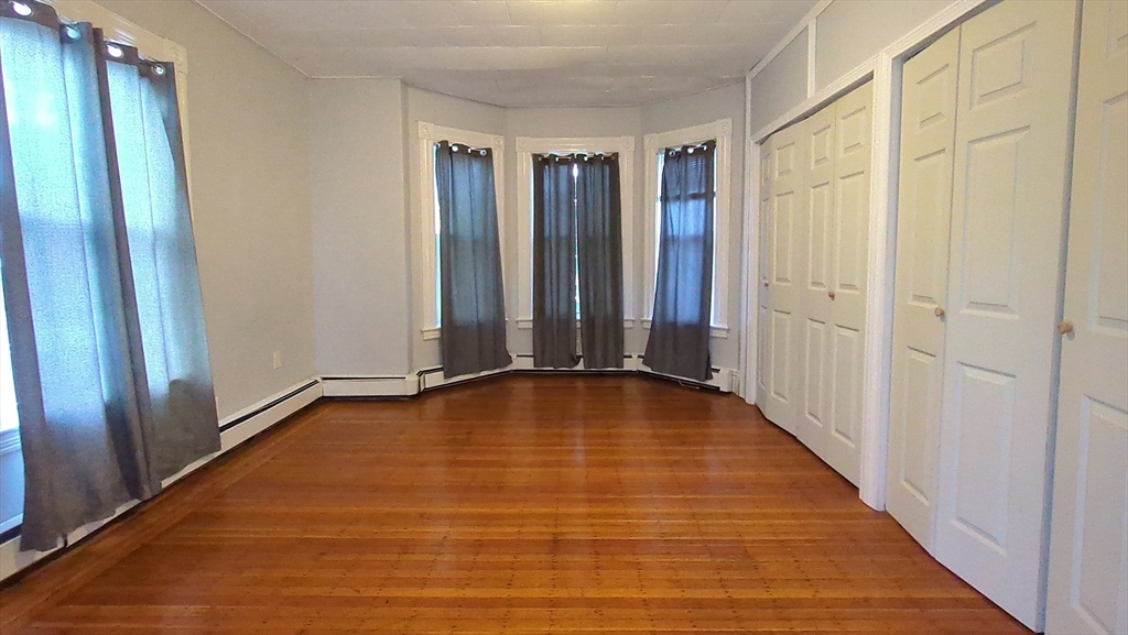 7 Cherry Street Lynn, MA 01902 - Photo 20 of 42 a view of an empty room with glass door