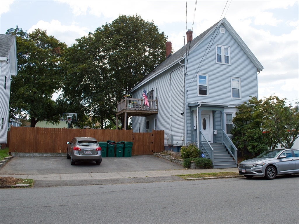 7 Cherry Street Lynn, MA 01902 - Photo 2 of 42 a car parked in front of a house