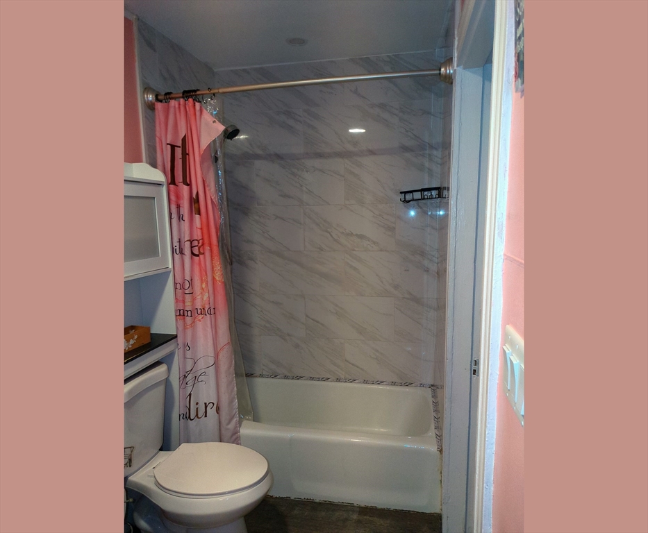 7 Cherry Street Lynn, MA 01902 - Photo 26 of 42 a bathroom with a toilet and a shower