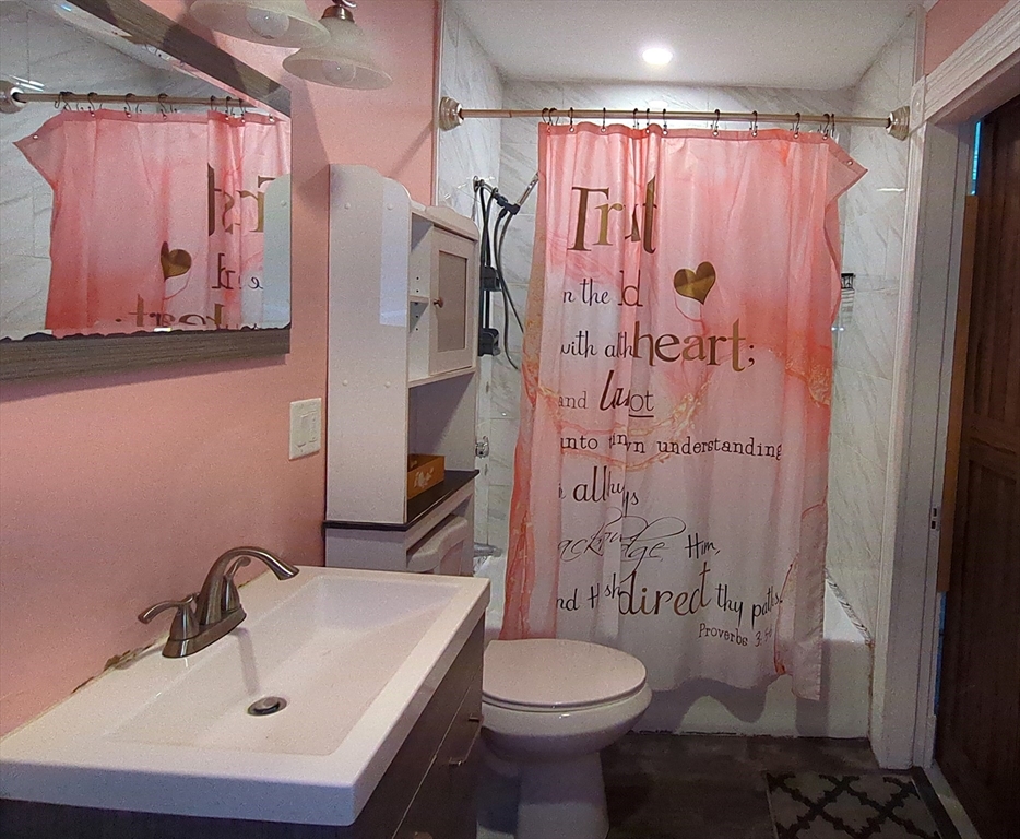 7 Cherry Street Lynn, MA 01902 - Photo 27 of 42 a bathroom with a sink and toilet