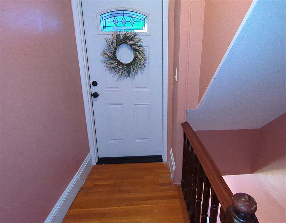 7 Cherry Street Lynn, MA 01902 - Photo 34 of 42 a view of a hallway with wooden floor