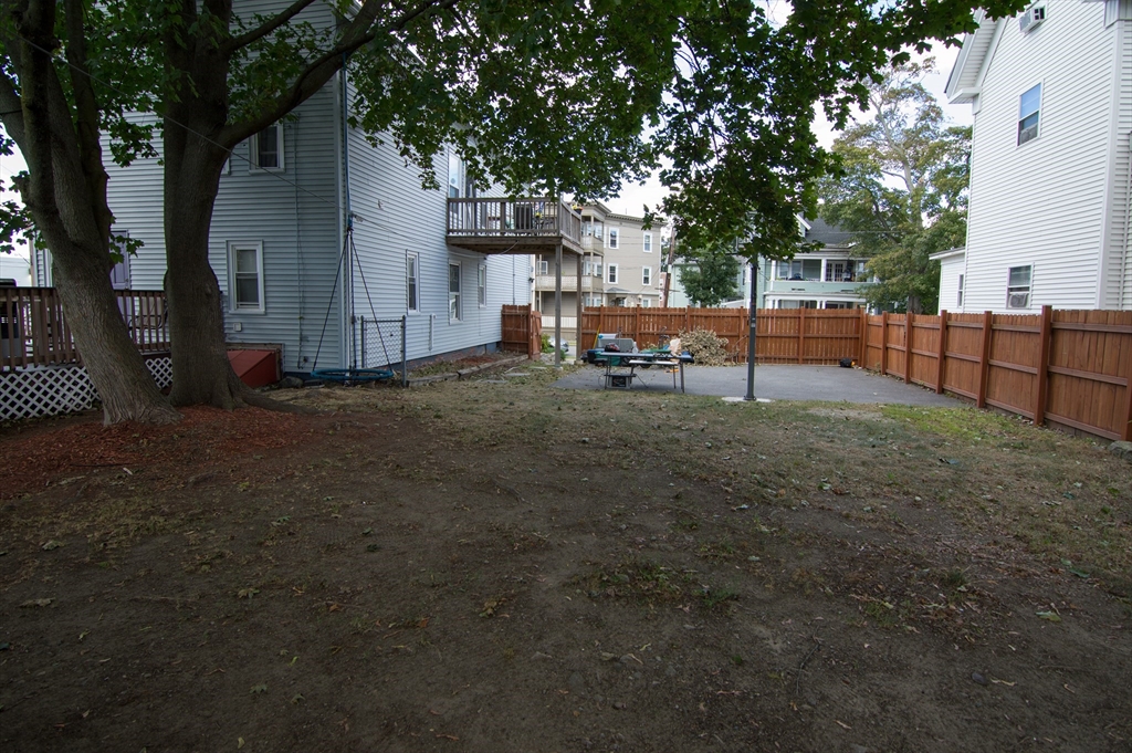 7 Cherry Street Lynn, MA 01902 - Photo 38 of 42 a view of backyard with deck and seating space