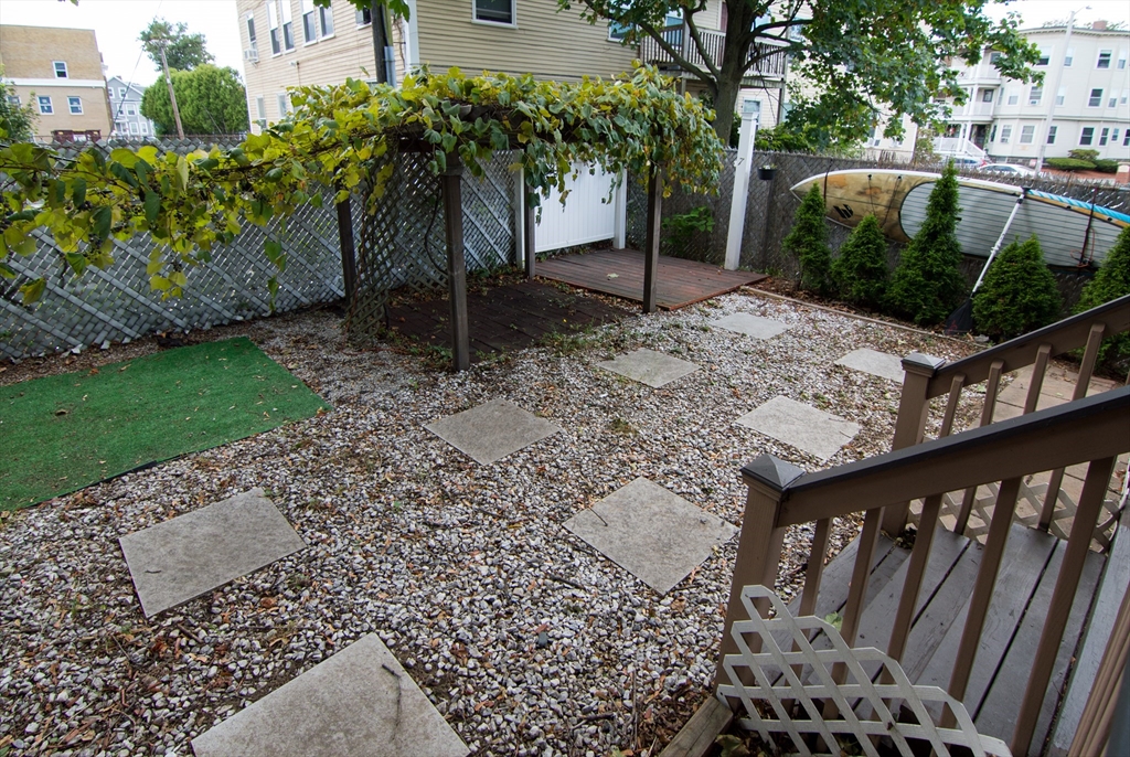 7 Cherry Street Lynn, MA 01902 - Photo 41 of 42 a view of a yard and car parked
