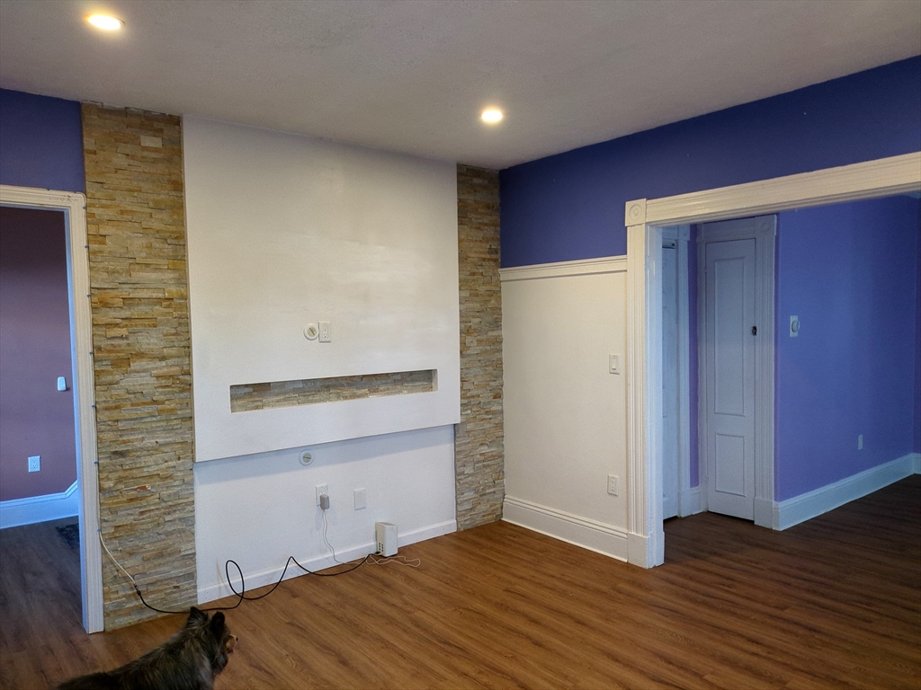 7 Cherry Street Lynn, MA 01902 - Photo 9 of 42 an empty room with wooden floor