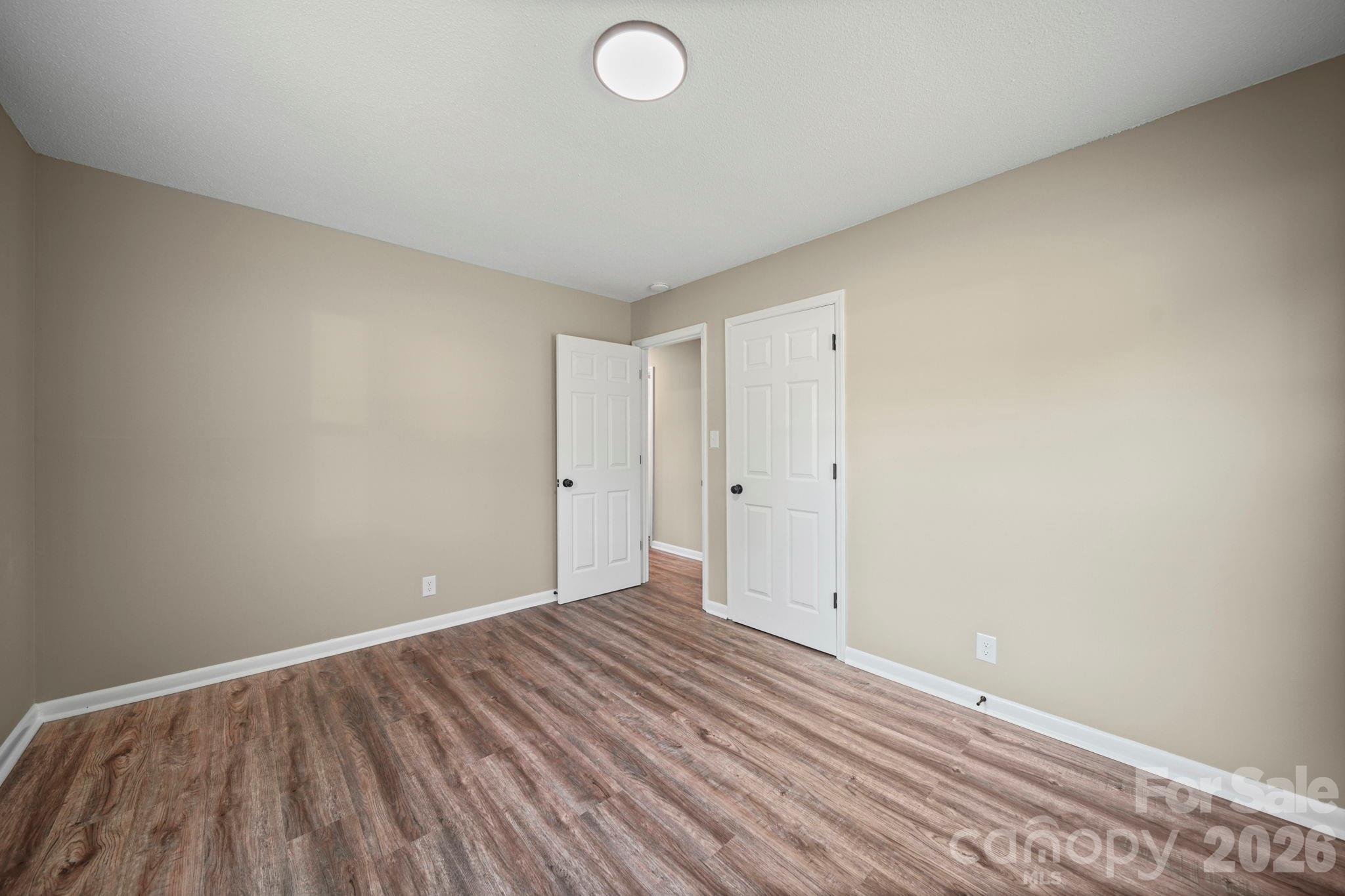 502 Geroid Street Salisbury, NC 28144 - Photo 15 of 31 an empty room with wooden floor and windows
