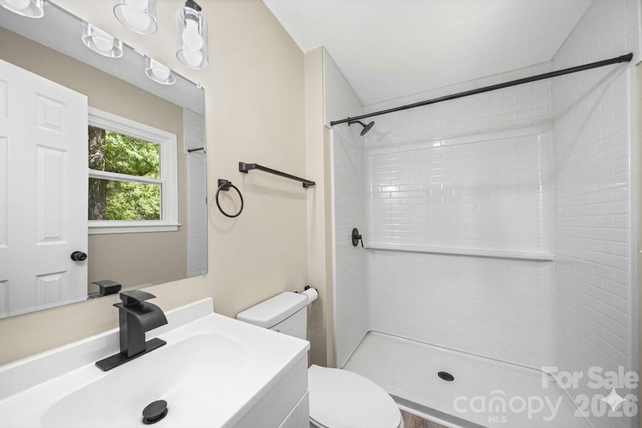 502 Geroid Street Salisbury, NC 28144 - Photo 16 of 31 a bathroom with a sink toilet and shower