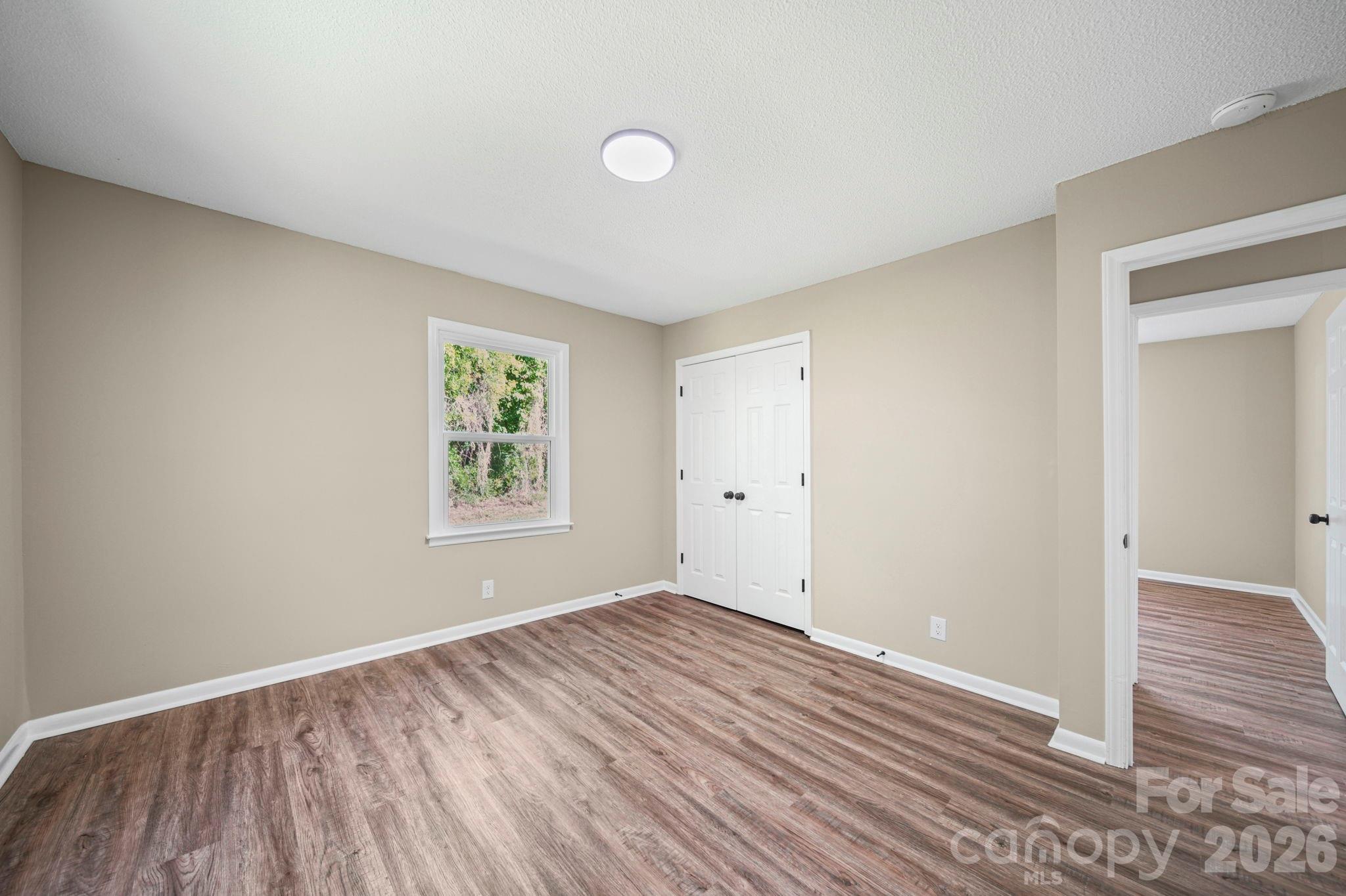 502 Geroid Street Salisbury, NC 28144 - Photo 17 of 31 a view of room with window and wooden floor