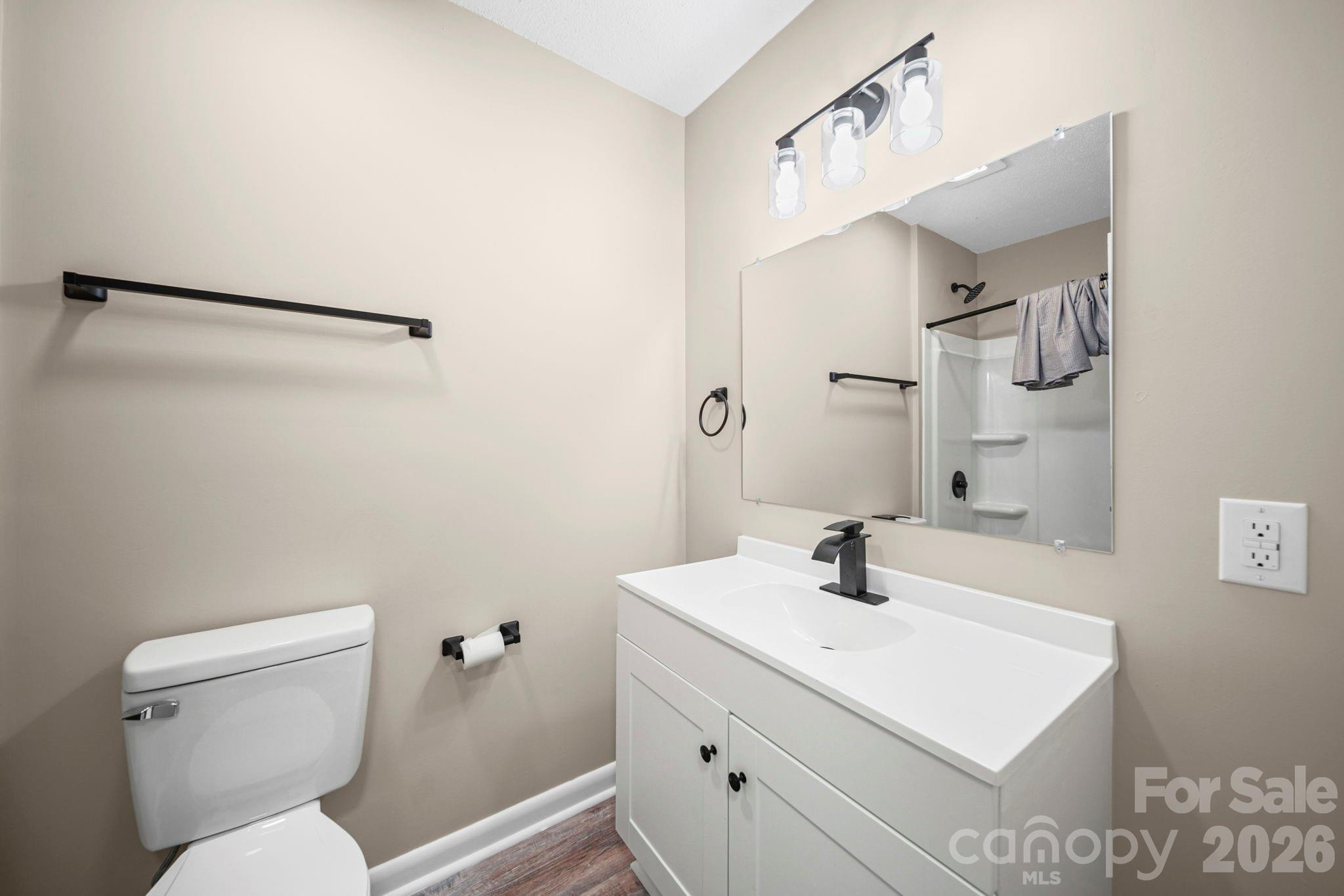 502 Geroid Street Salisbury, NC 28144 - Photo 23 of 31 a bathroom with a sink toilet and vanity