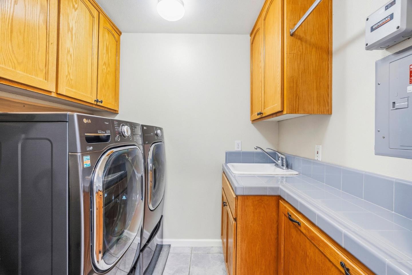2500 Nelson Road Scotts Valley, CA 95066 - Photo 37 of 77 a utility room with a sink a washer and dryer