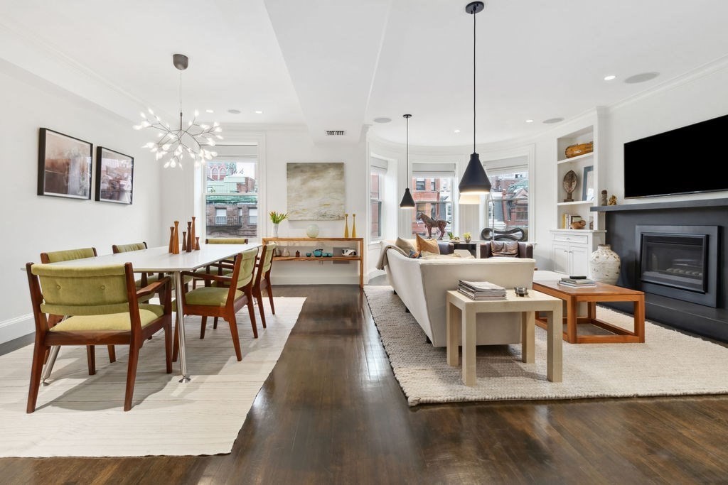 157 Newbury Street, Unit 4 Boston, MA 02116 - Photo 2 of 26 a view of a dining room with furniture window and wooden floor