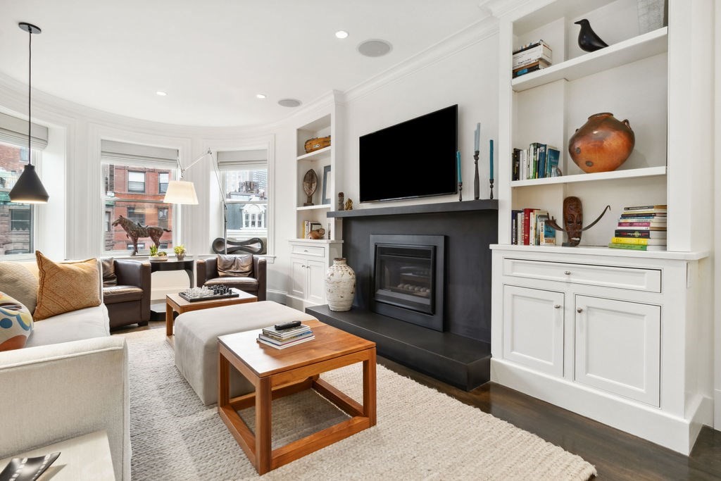157 Newbury Street, Unit 4 Boston, MA 02116 - Photo 4 of 26 a living room with furniture fireplace and flat screen tv