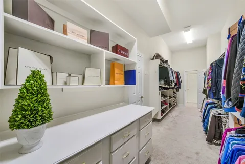 a large bathroom with a sink and a large mirror