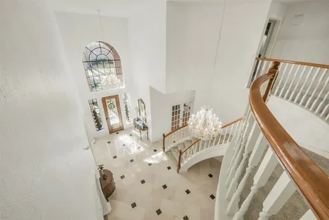 a living room with furniture gym equipment and a flat screen tv
