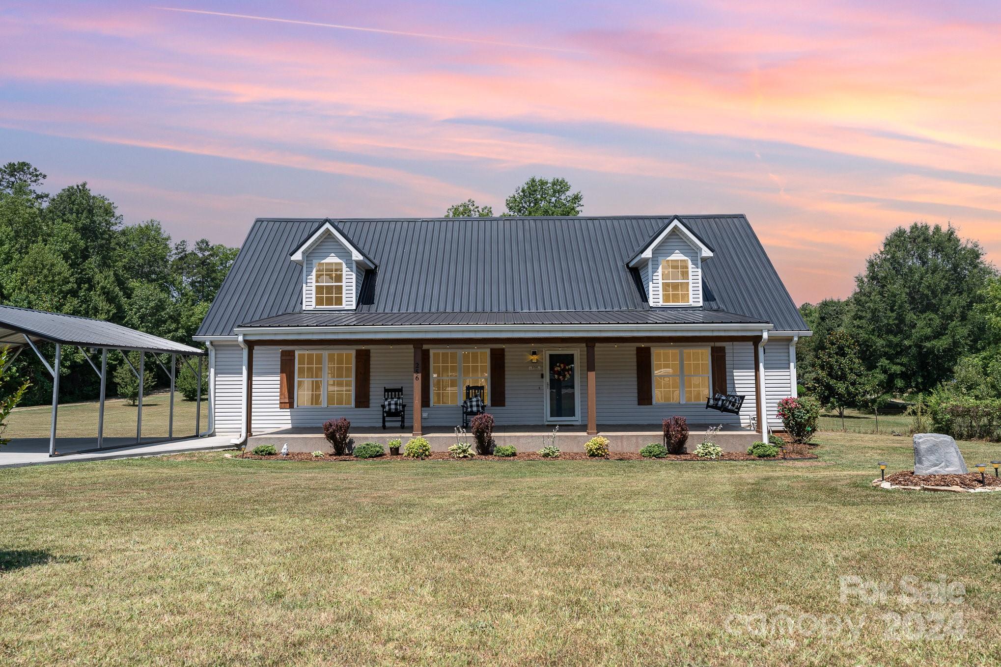 256 Hemlock Road Cleveland, NC 27013 - Photo 1 of 32 a front view of a house with garden