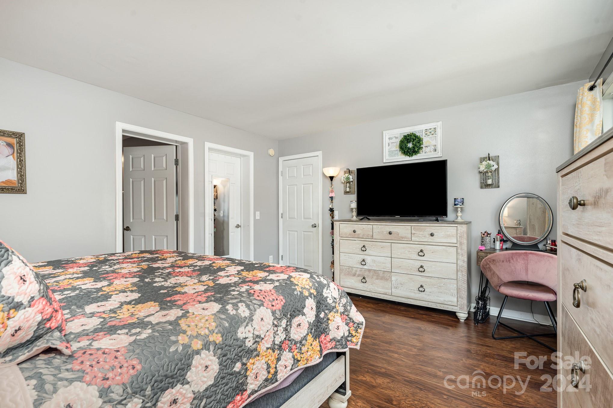 256 Hemlock Road Cleveland, NC 27013 - Photo 11 of 32 a bedroom with a bed and flat screen tv