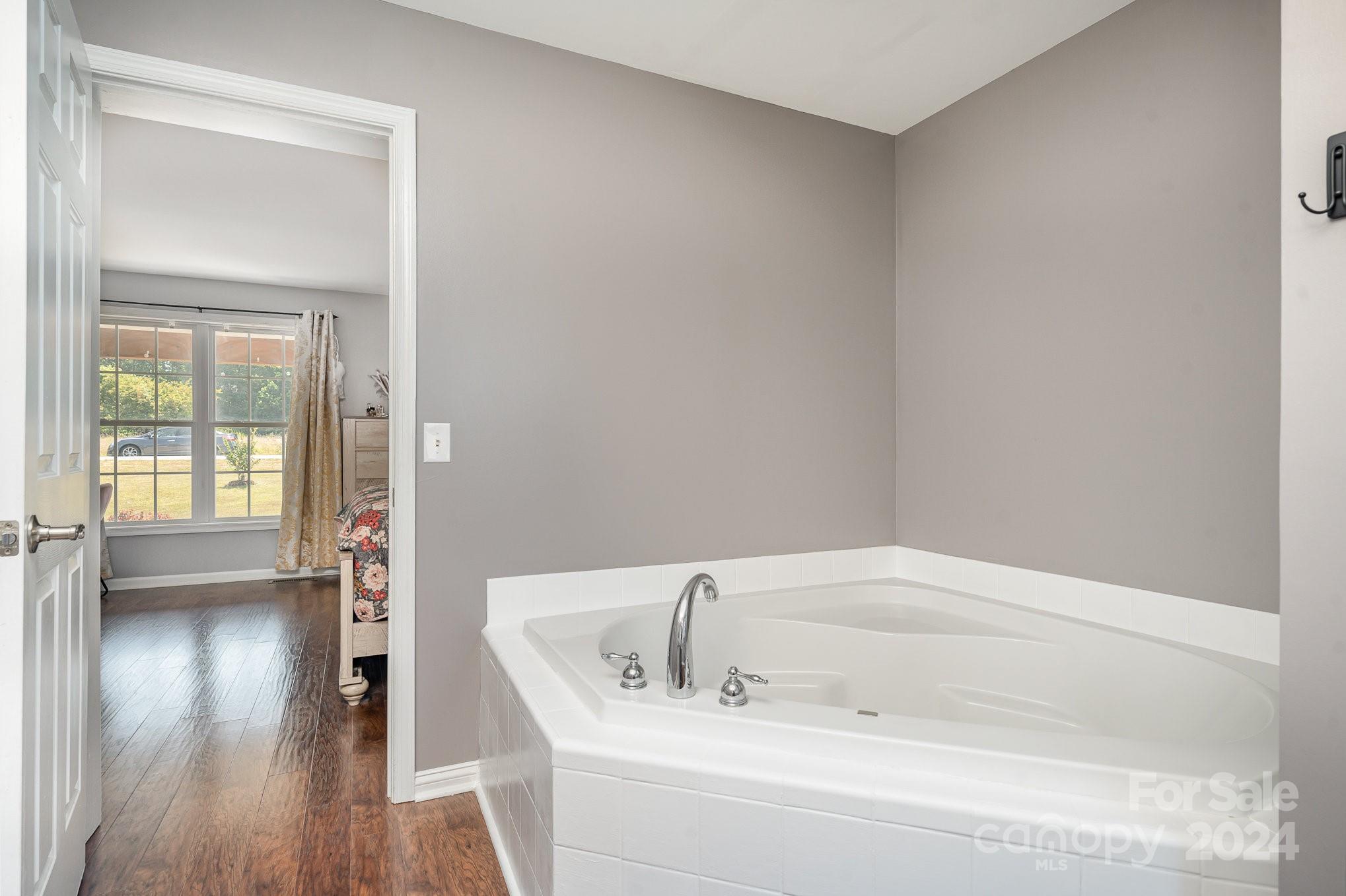 256 Hemlock Road Cleveland, NC 27013 - Photo 12 of 32 a bathroom with a bathtub