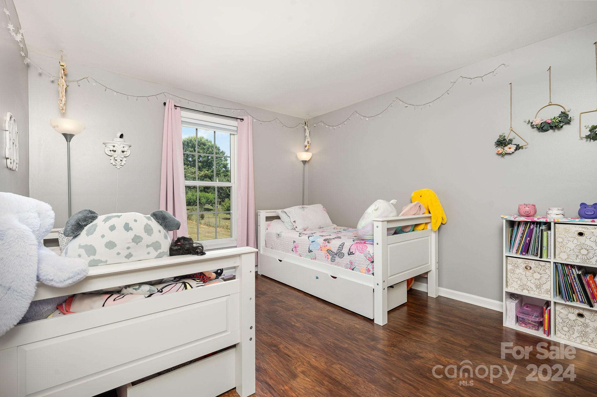 256 Hemlock Road Cleveland, NC 27013 - Photo 16 of 32 a bed room with furniture and decor