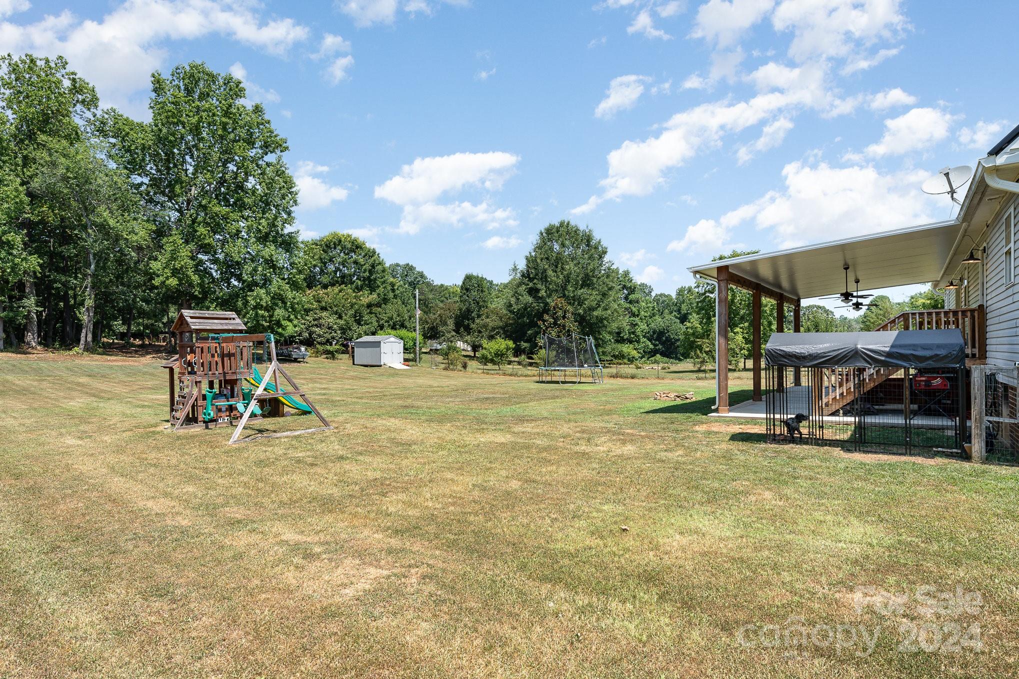 256 Hemlock Road Cleveland, NC 27013 - Photo 25 of 32 a view of a playground with basketball court