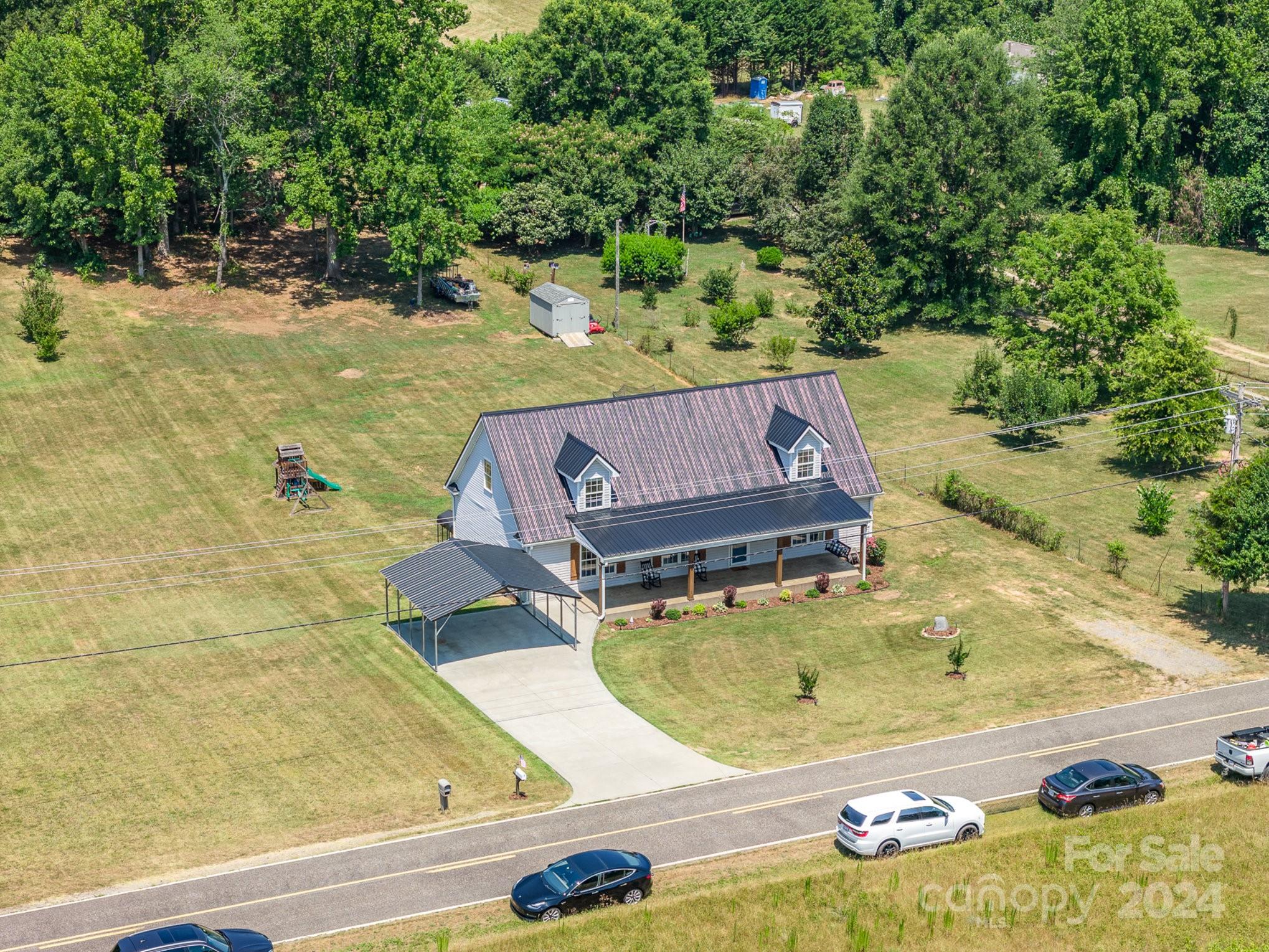 256 Hemlock Road Cleveland, NC 27013 - Photo 29 of 32 a view of a swimming pool with yard