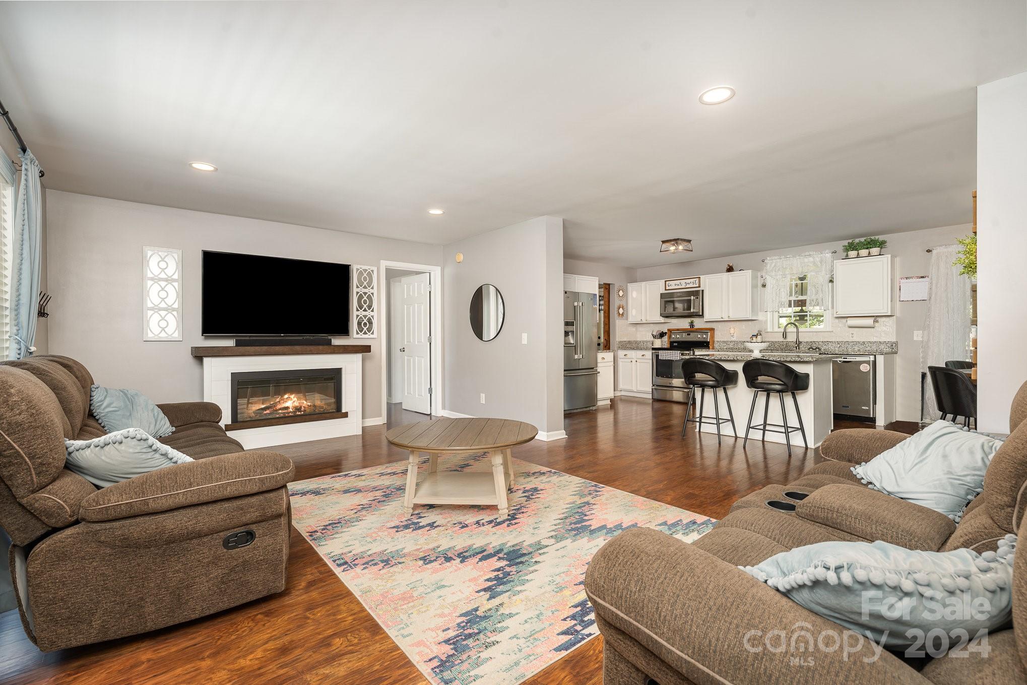 256 Hemlock Road Cleveland, NC 27013 - Photo 5 of 32 a living room with furniture and a flat screen tv