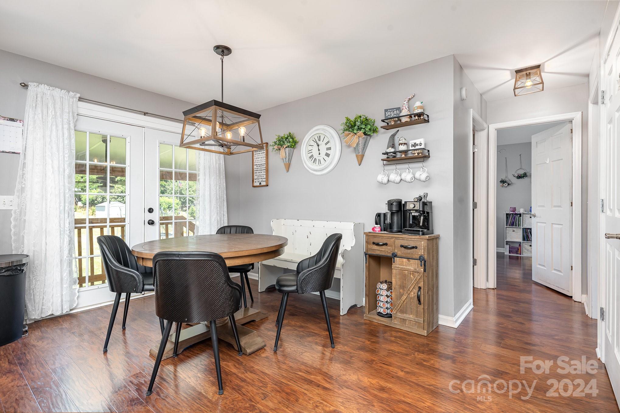 256 Hemlock Road Cleveland, NC 27013 - Photo 9 of 32 a view of a dining room with furniture window and wooden floor