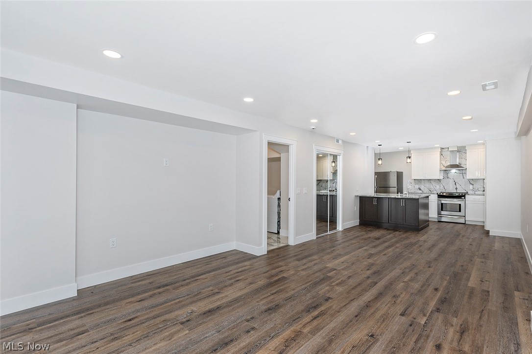 20601 Shelburne Road Shaker Heights, OH 44122 - Photo 23 of 29 First level living room featuring dark wood-style flooring and recessed lighting
