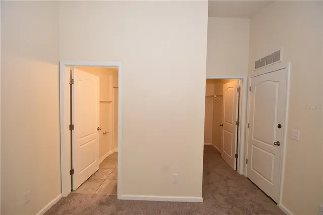 a view of a hallway with closet