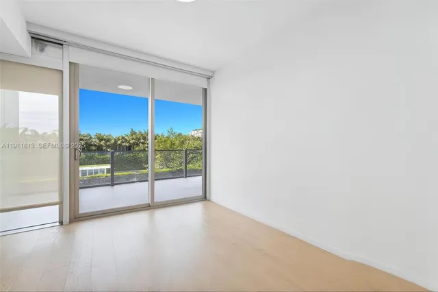 a bathroom with a granite countertop sink a toilet and a mirror