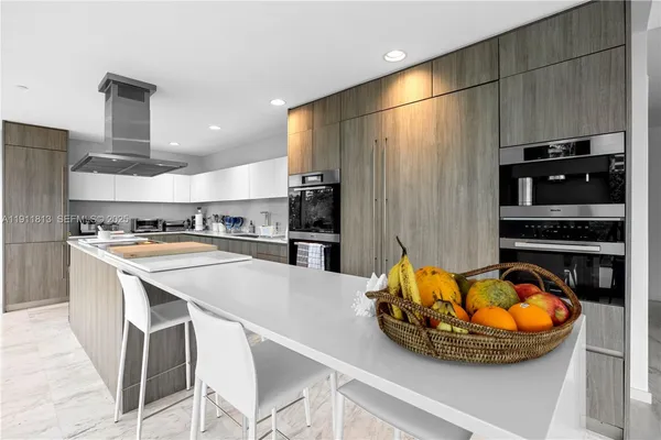 a view of an empty room with wooden floor and a sliding door