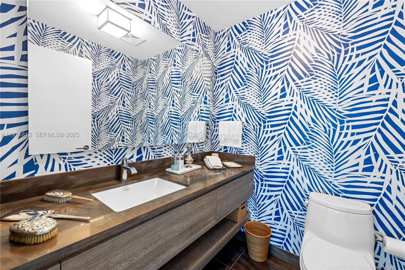 350 Ocean Drive, Unit 301N Key Biscayne, FL 33149 - Photo 19 of 41 a bathroom with a sink and a mirror